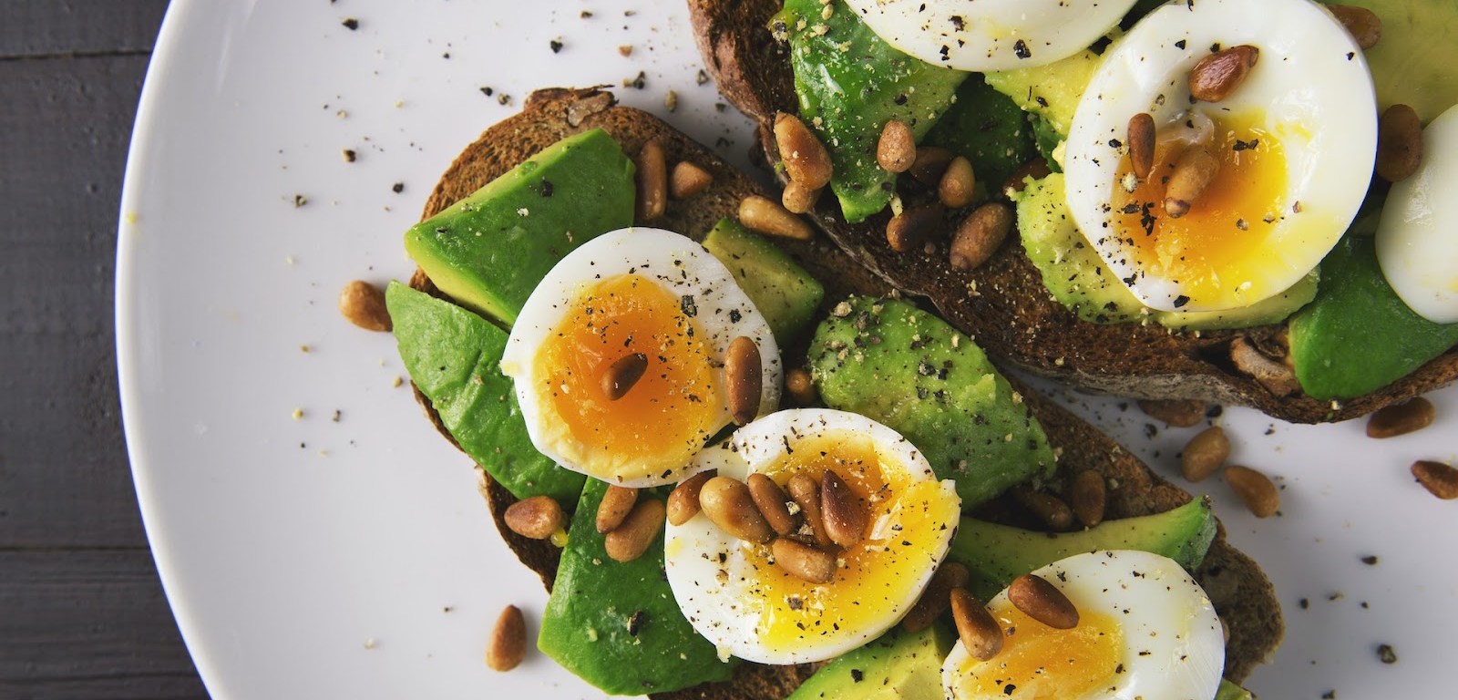 a plate of pastry with avocados and boiled eggs